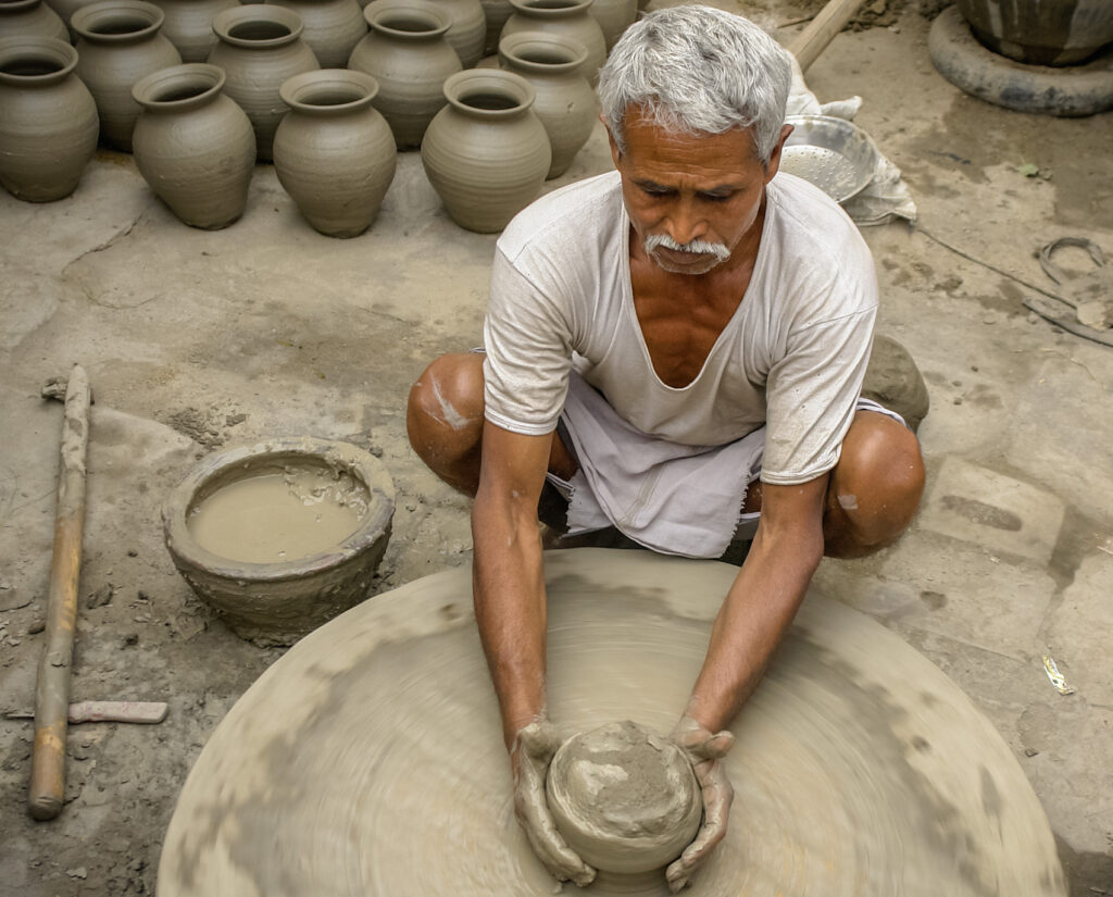 Potter making pottery in India